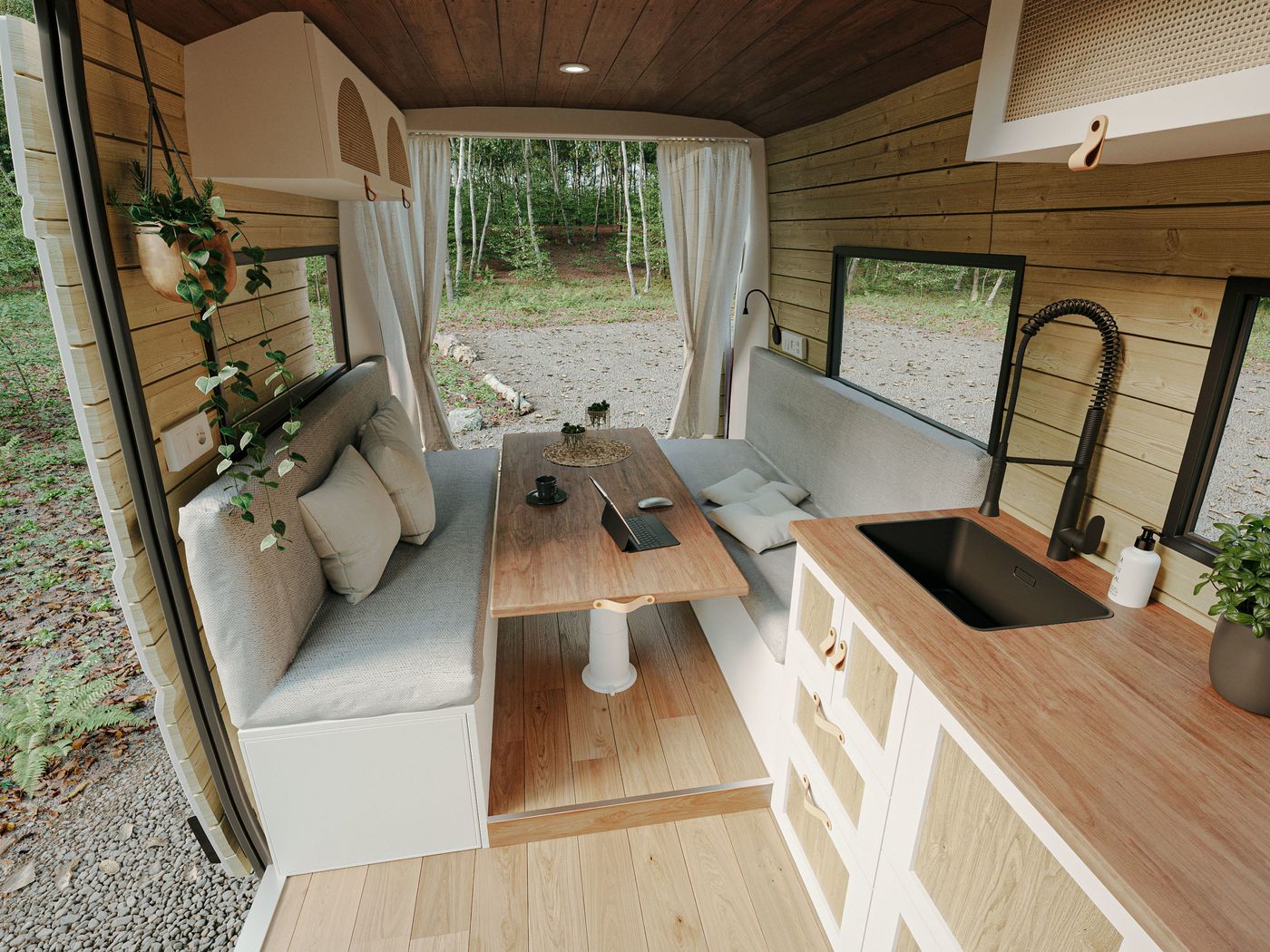 Zona de comedor de una camper de Nomade Nation: espacio multifuncional ideal para comer, trabajar o relajarse en la furgoneta.