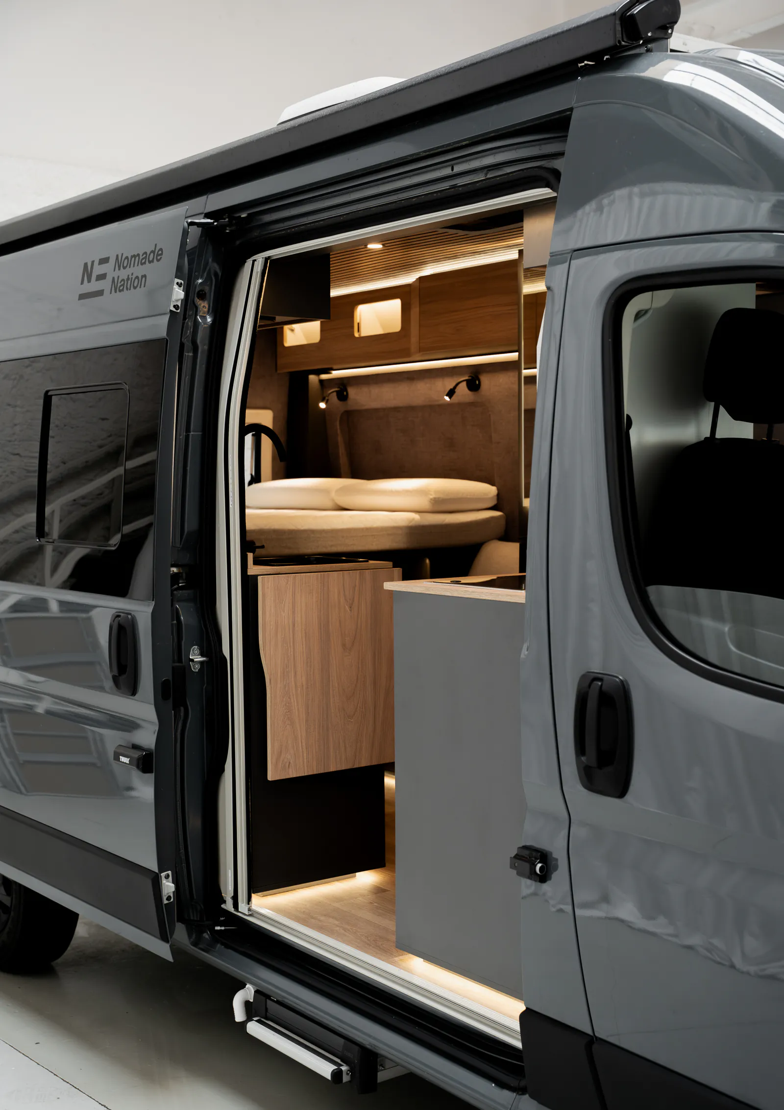 The Neo S with the side door open, showing the kitchen and the living area