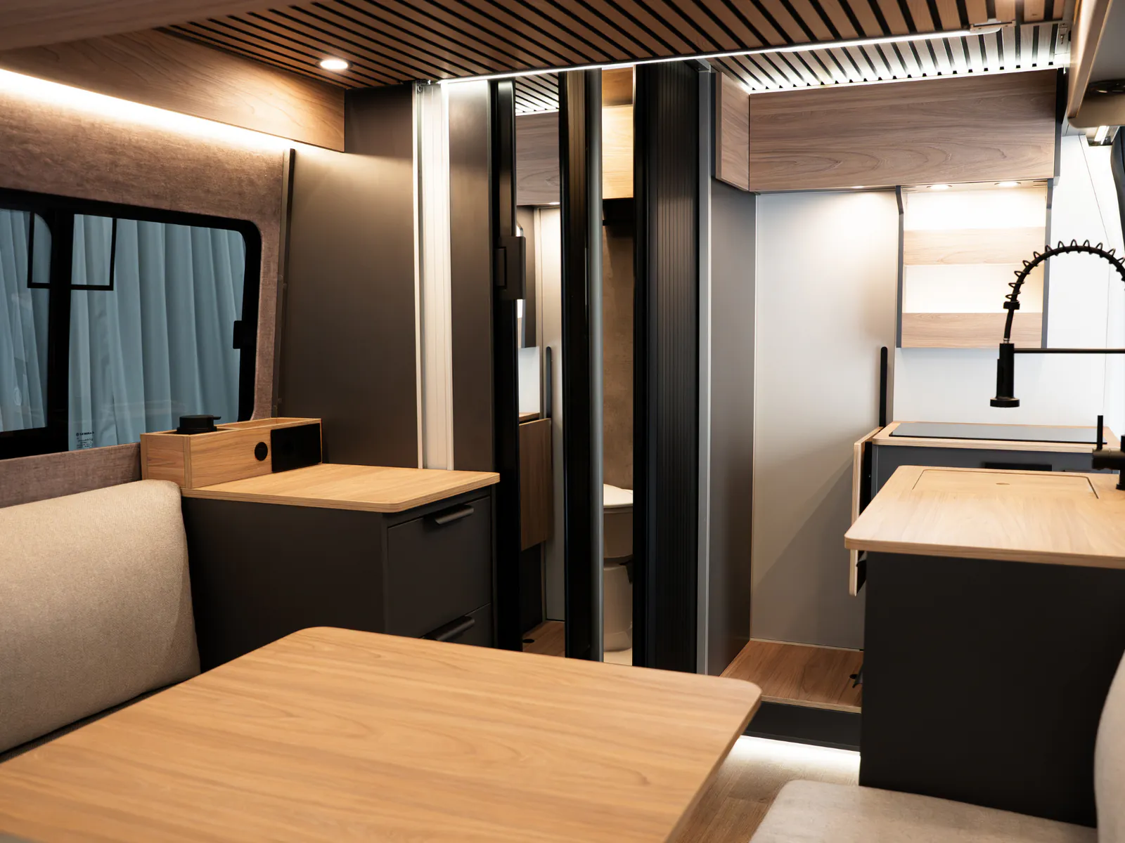 The galley with sink and folding tap, seen from the lounge
