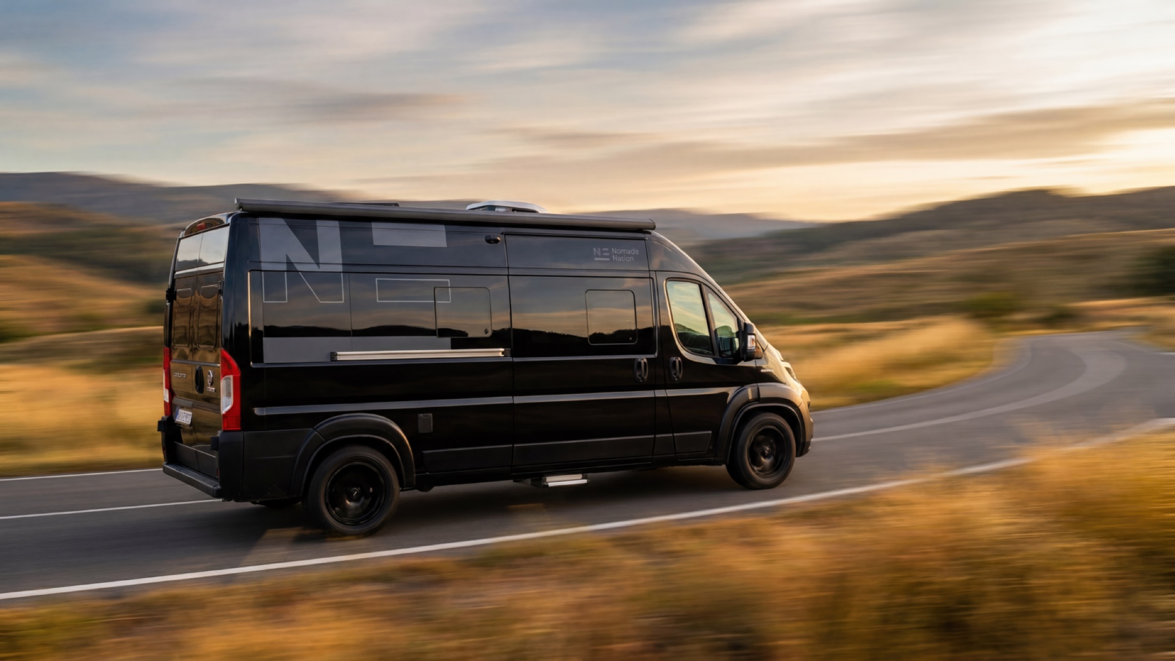 A Nomade Neo on the road at sunset