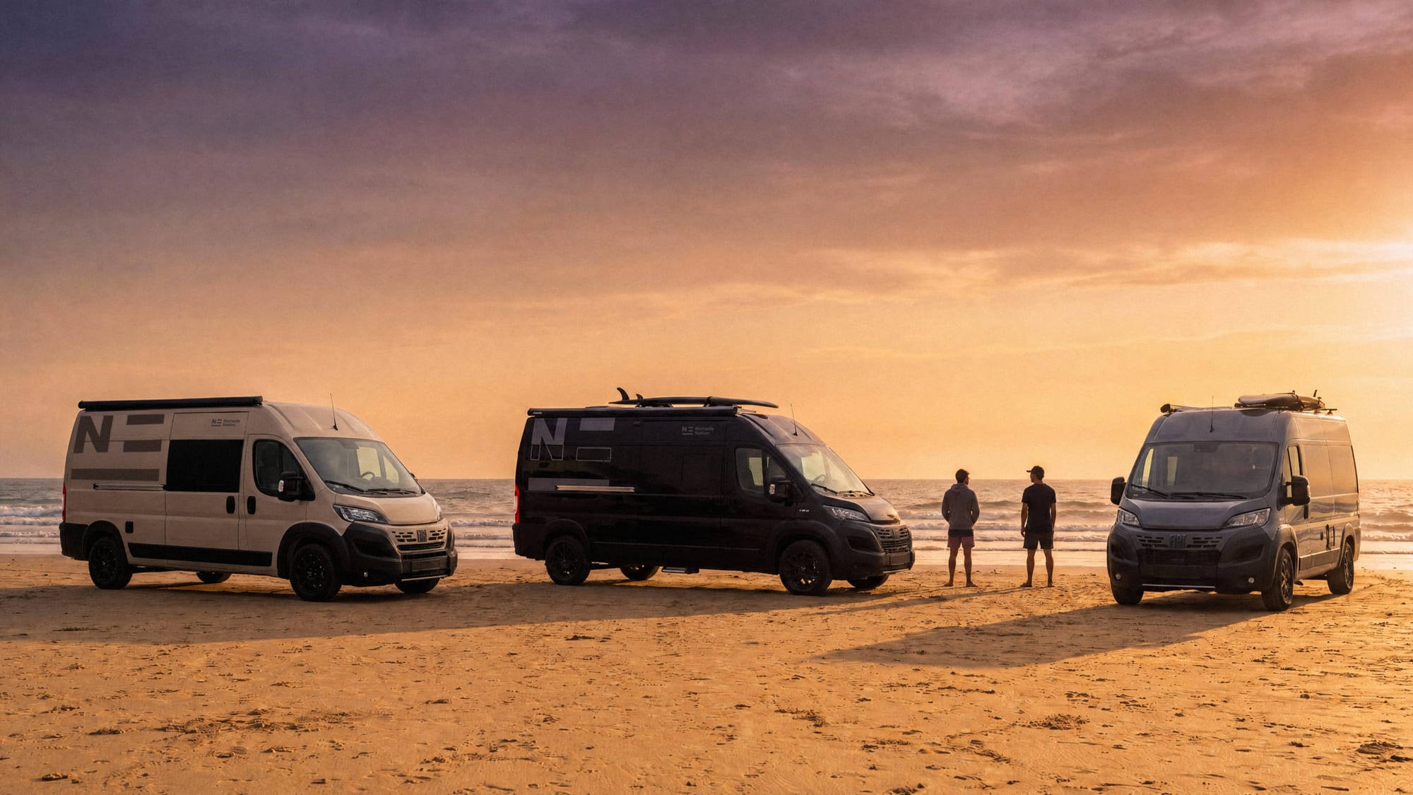 Three Nomade campers parked on the beach at sunset